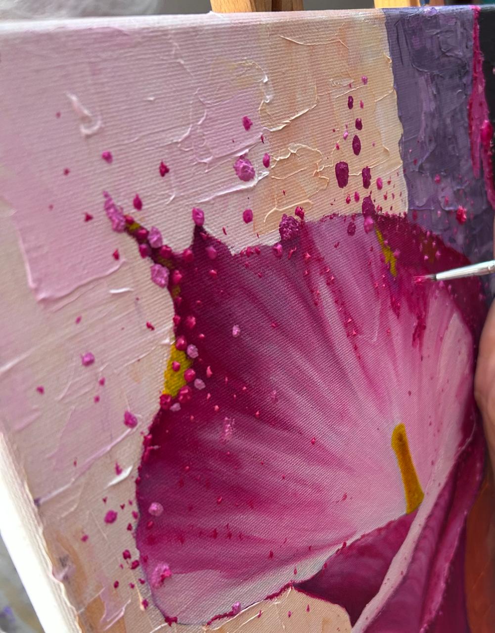 Close-up of textured pink hibiscus flower painting in progress with vivid magenta paint splatters